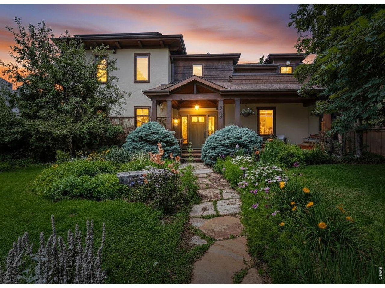 3135 11th Street Boulder, CO 80304 - Photo 1 of 50 a front view of a house with a yard
