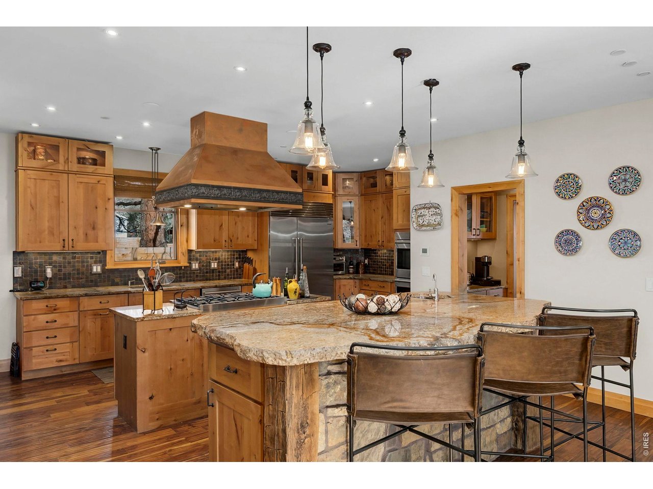 3135 11th Street Boulder, CO 80304 - Photo 12 of 50 a kitchen with a table chairs stove and cabinets
