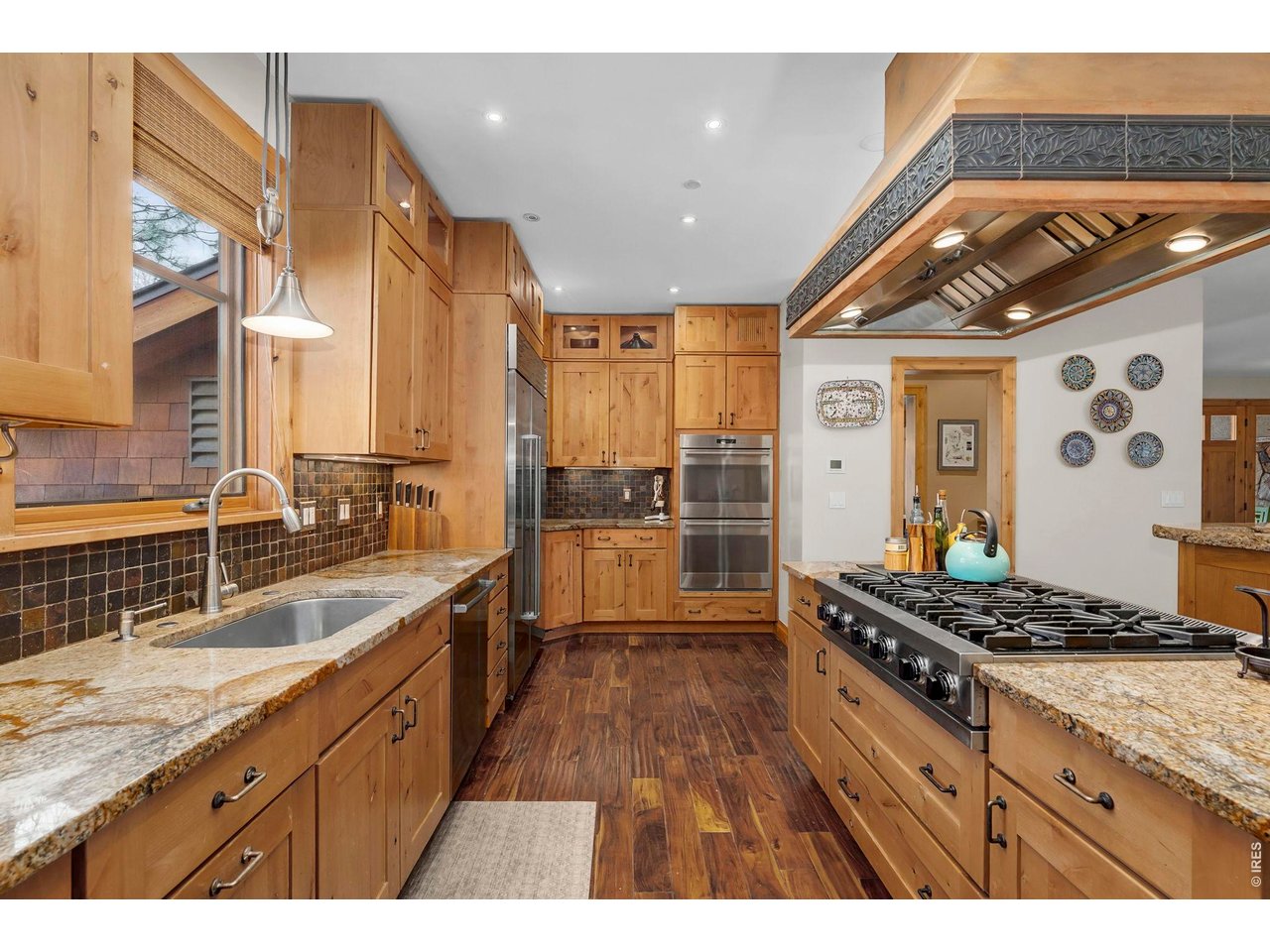 3135 11th Street Boulder, CO 80304 - Photo 15 of 50 a kitchen with stainless steel appliances granite countertop a stove a sink and a refrigerator