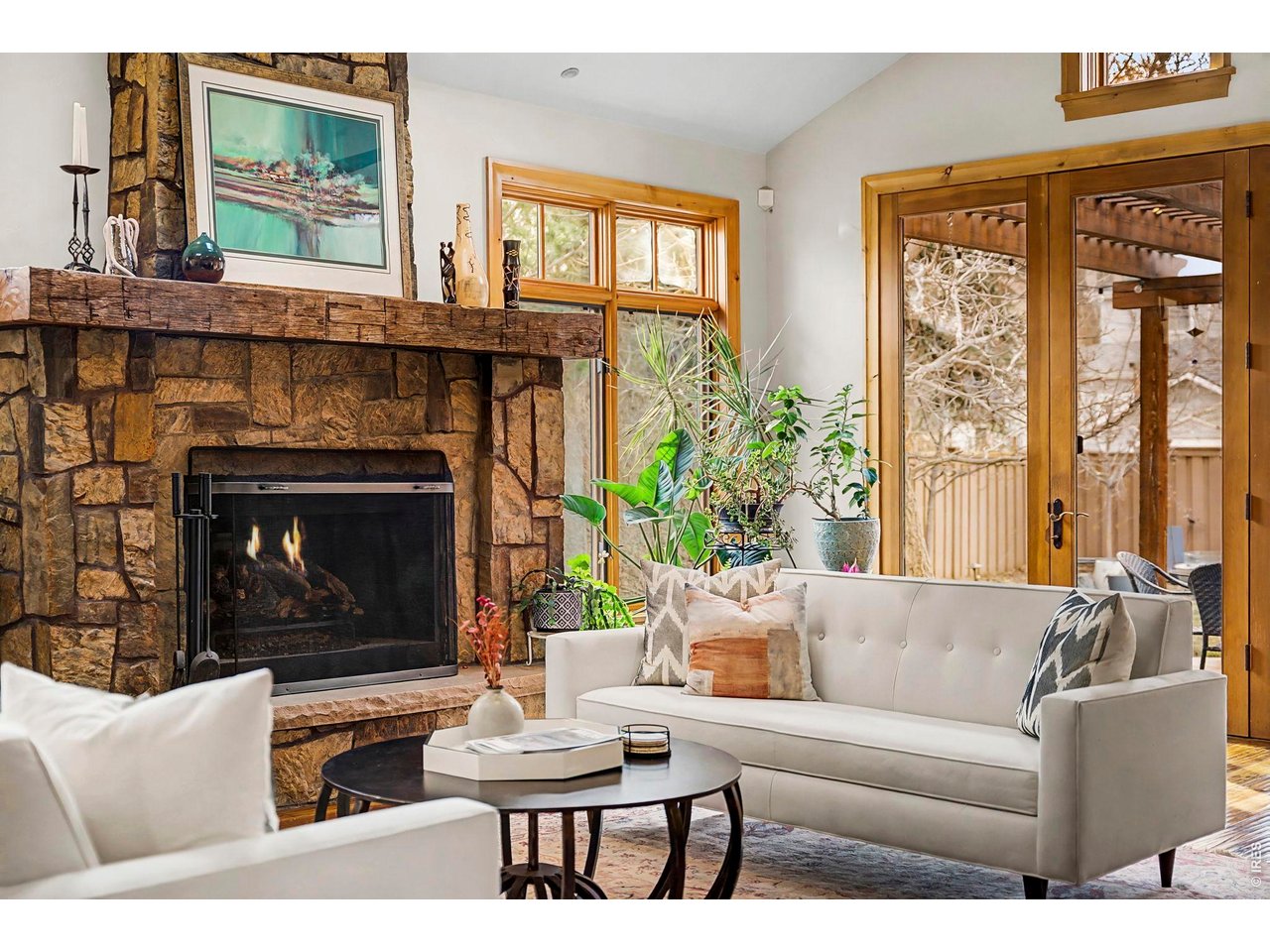 3135 11th Street Boulder, CO 80304 - Photo 19 of 50 a living room with furniture a large window and a fireplace