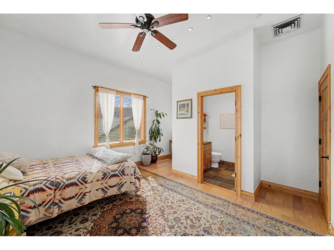 3135 11th Street Boulder, CO 80304 - Photo 37 of 50 a bedroom with a bed and a window