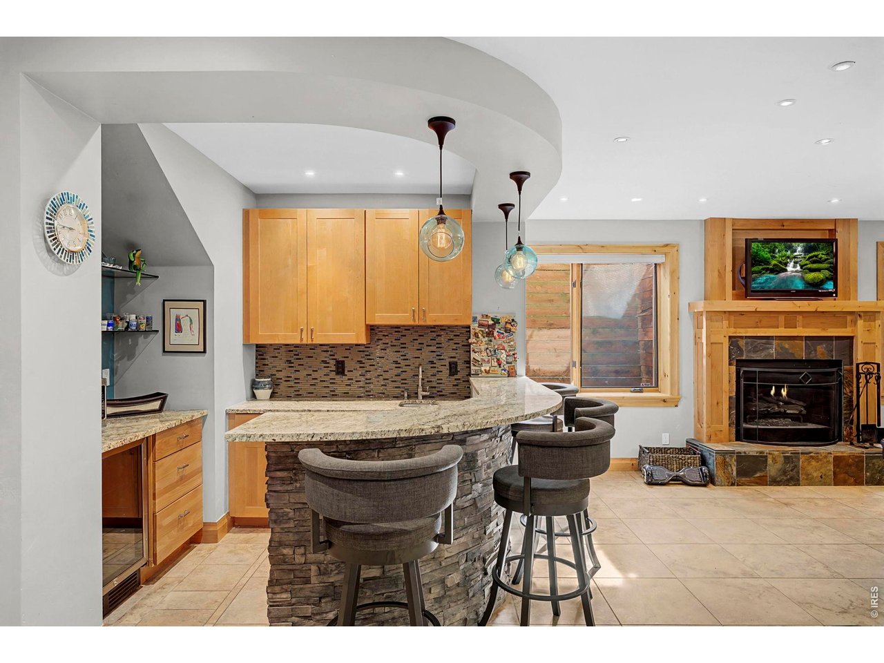 3135 11th Street Boulder, CO 80304 - Photo 38 of 50 a kitchen with a stove a refrigerator and a fireplace