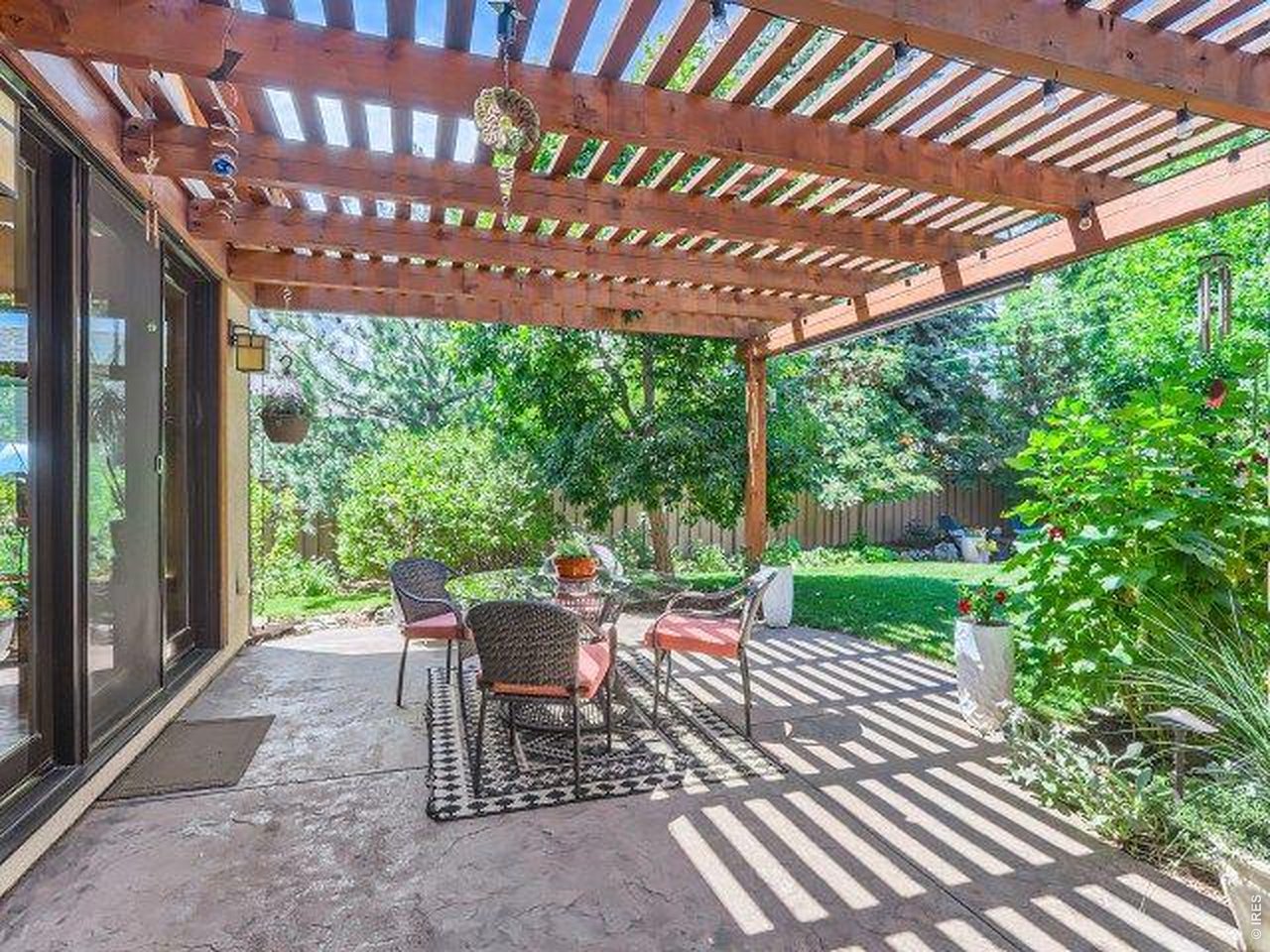 3135 11th Street Boulder, CO 80304 - Photo 48 of 50 a view of a patio with a table chairs and a backyard