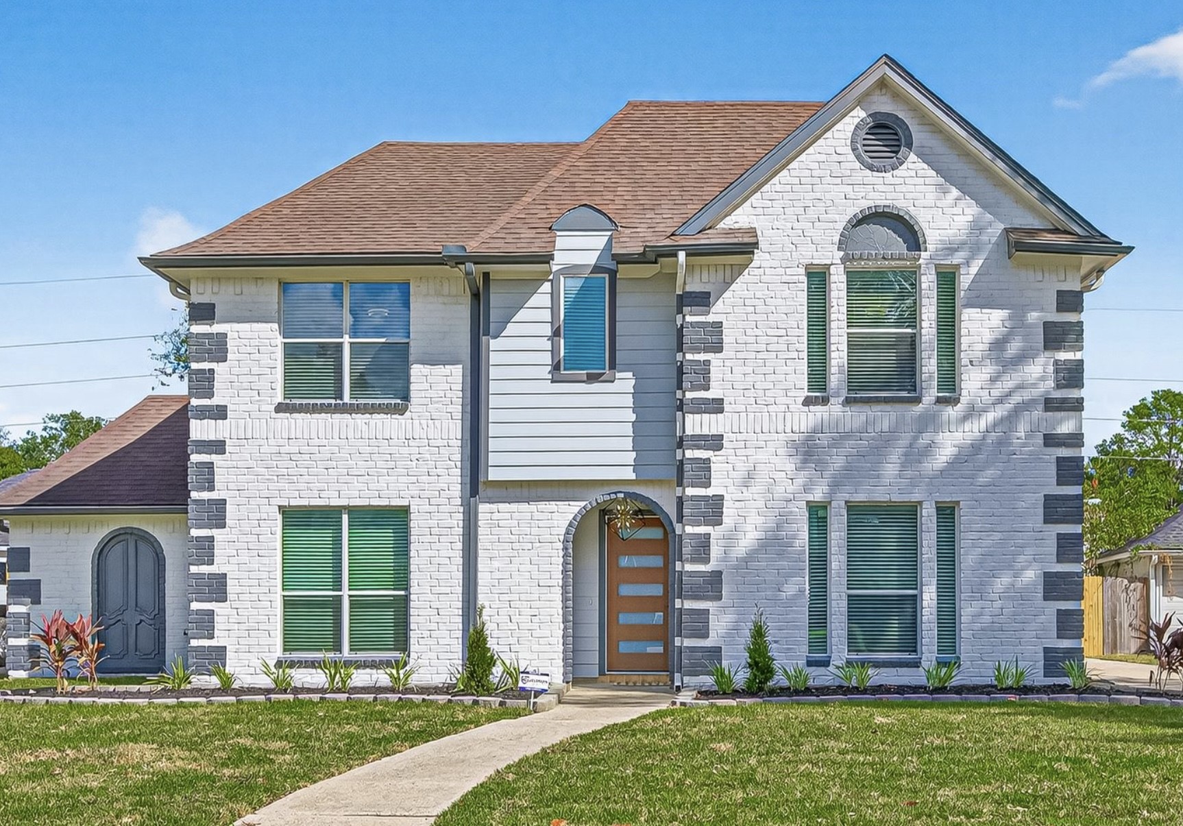 11506 Colonial Trail Drive Houston, TX 77066 - Photo 1 of 42 Stunning two-story painted brick exterior with modern front door, arched entry, and elegant architectural details. Fresh landscaping and clean lines create exceptional curb appeal and a welcoming first impression.