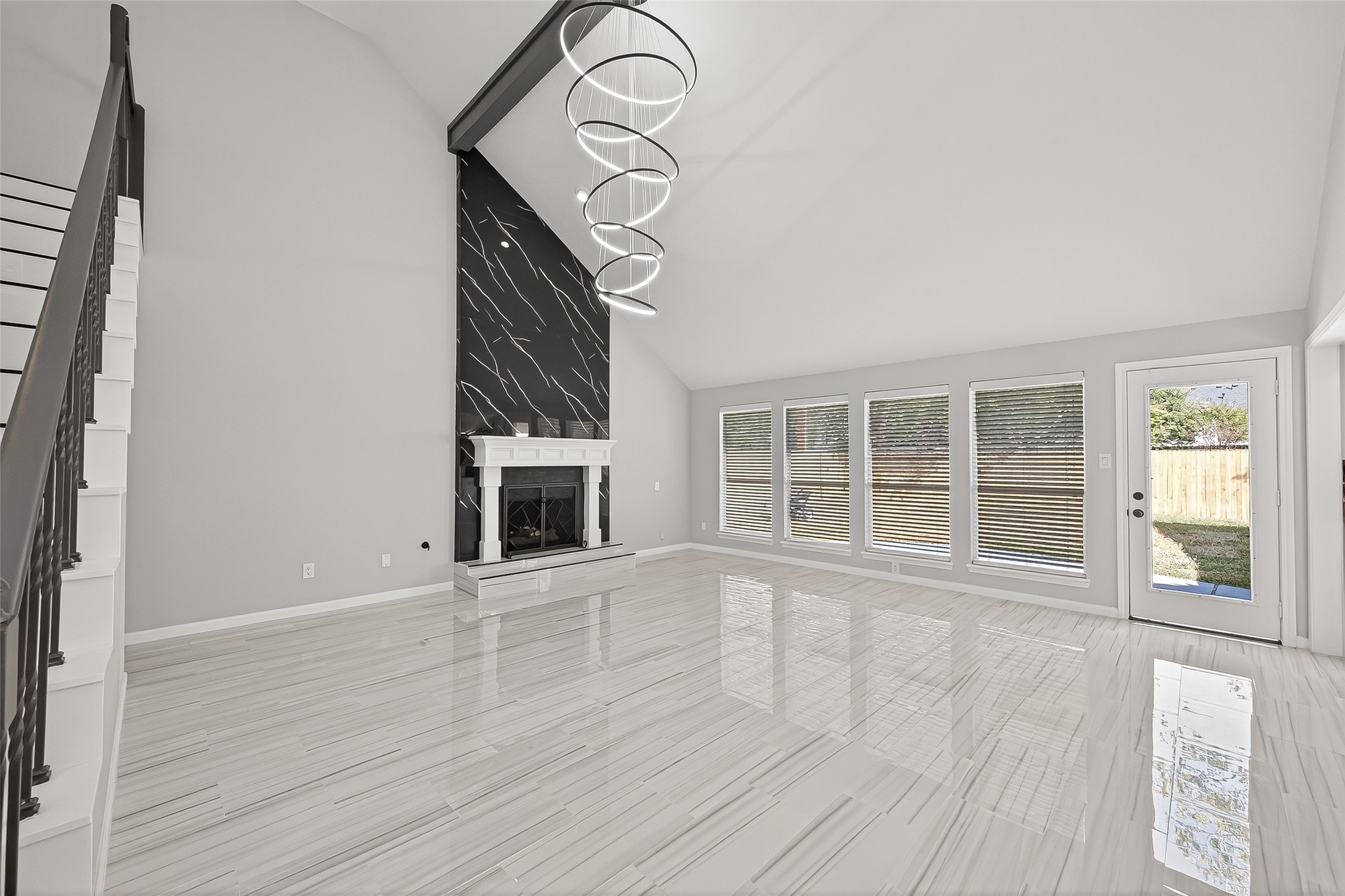 11506 Colonial Trail Drive Houston, TX 77066 - Photo 13 of 42 an empty room with wooden floor cabinet and windows