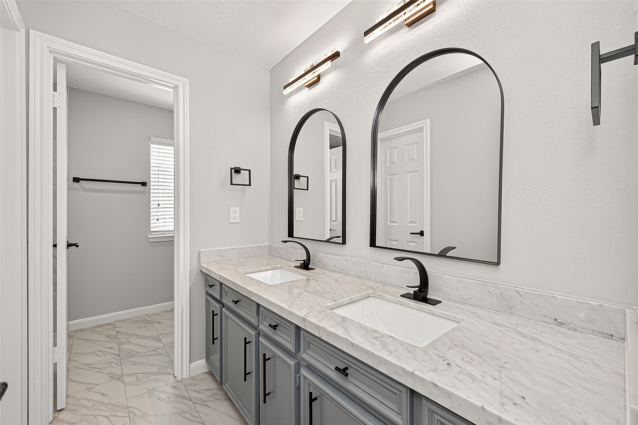 11506 Colonial Trail Drive Houston, TX 77066 - Photo 34 of 42 a bathroom with a granite countertop sink a large mirror and vanity