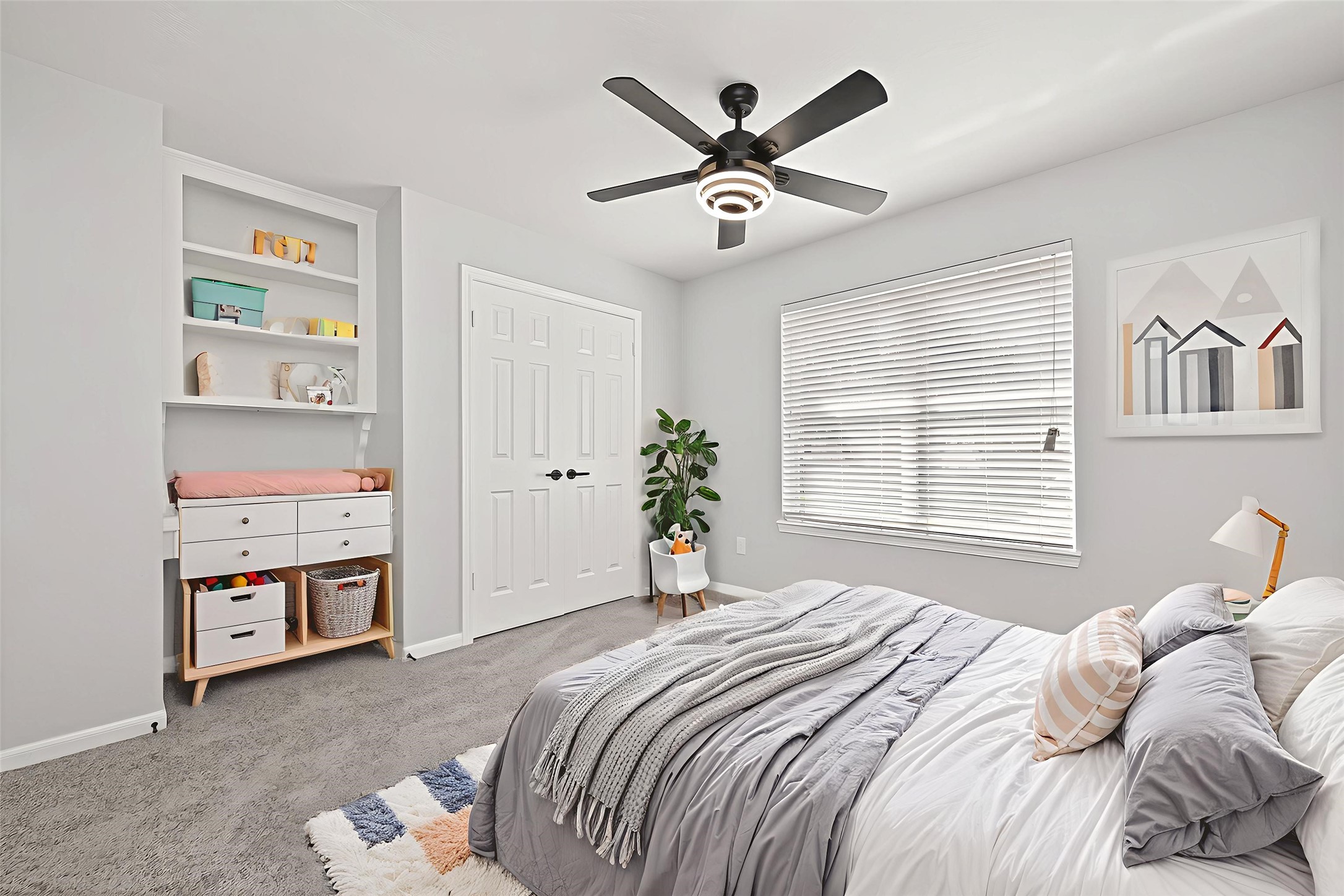 11506 Colonial Trail Drive Houston, TX 77066 - Photo 36 of 42 a bedroom with a large bed and a chandelier