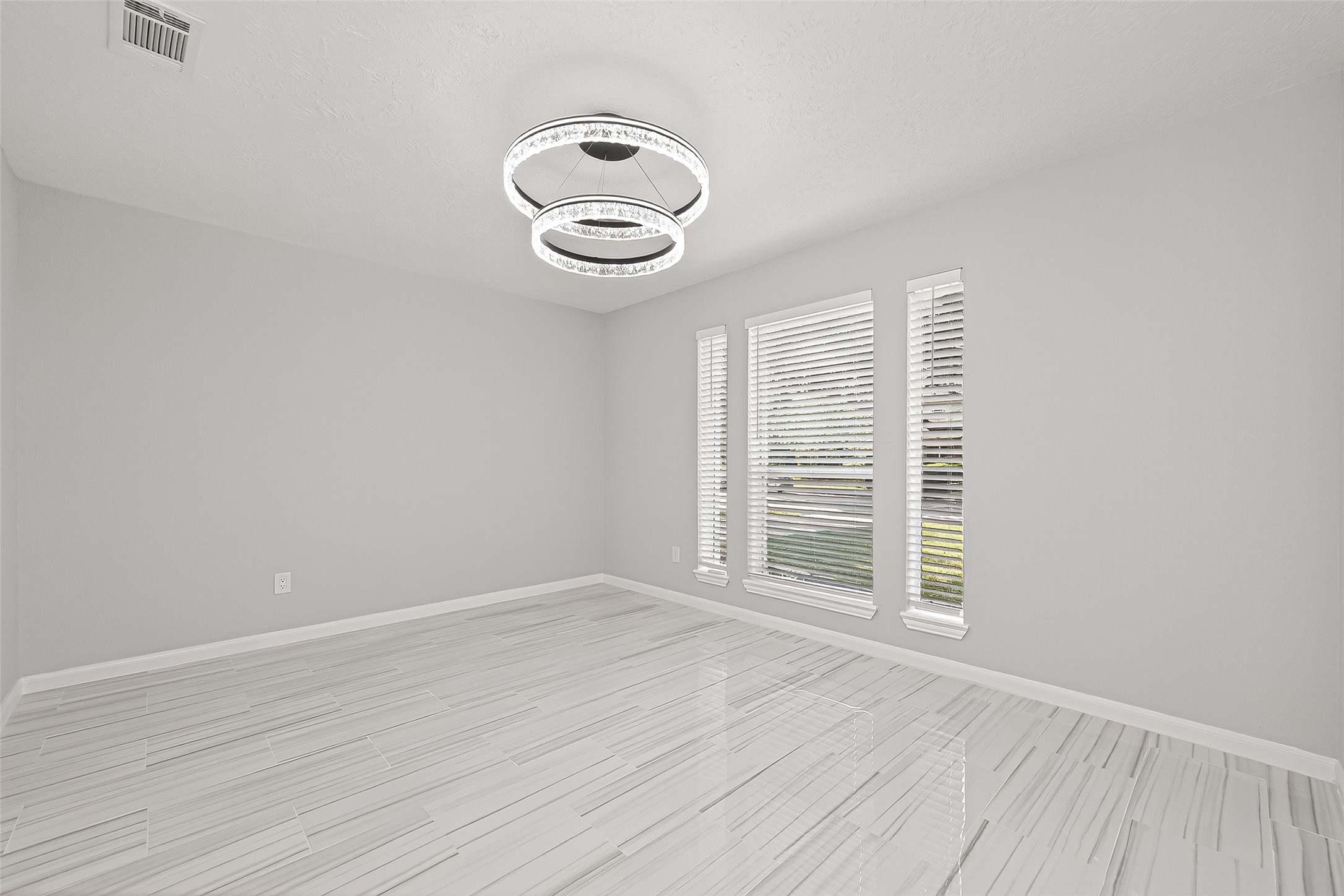 11506 Colonial Trail Drive Houston, TX 77066 - Photo 7 of 42 an empty room with wooden floor and windows