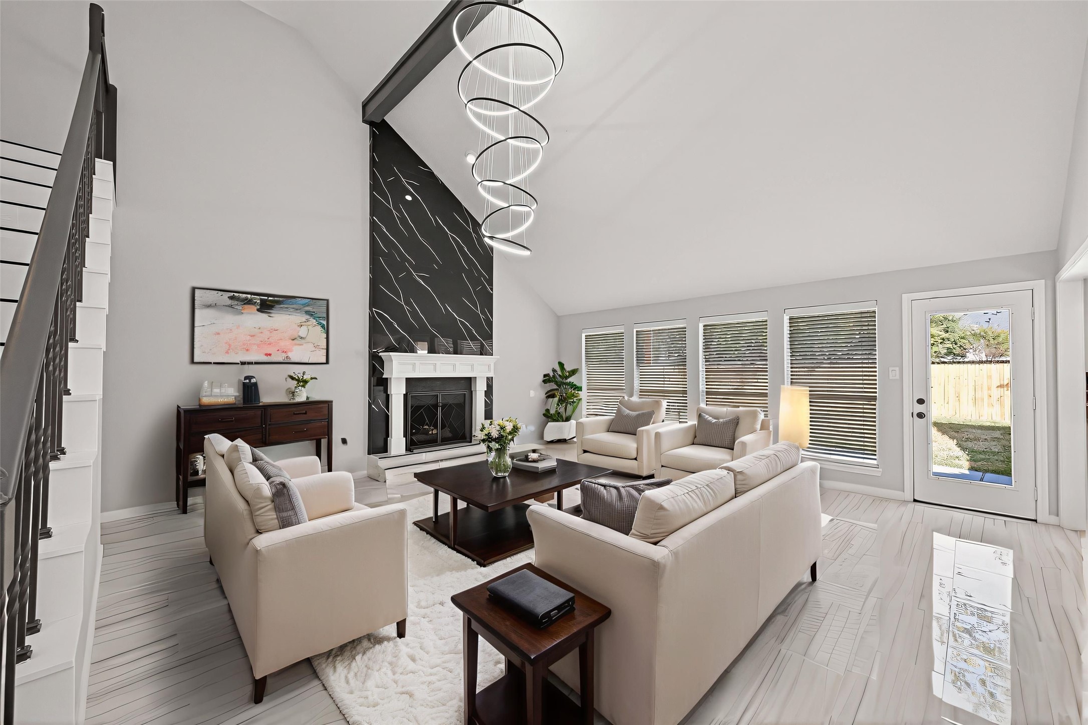 11506 Colonial Trail Drive Houston, TX 77066 - Photo 10 of 42 a living room with furniture a fireplace and a large window