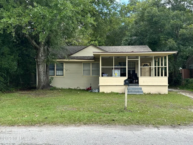 a house view with a sitting space and garden