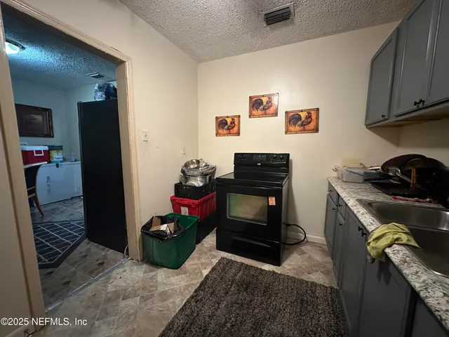 a bedroom with furniture and a dresser