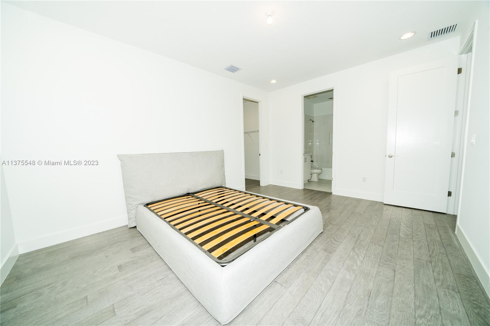 17232 Teton River Road Boca Raton, FL 33496 - Photo 14 of 28 a view of room with deck entryway and wooden floor