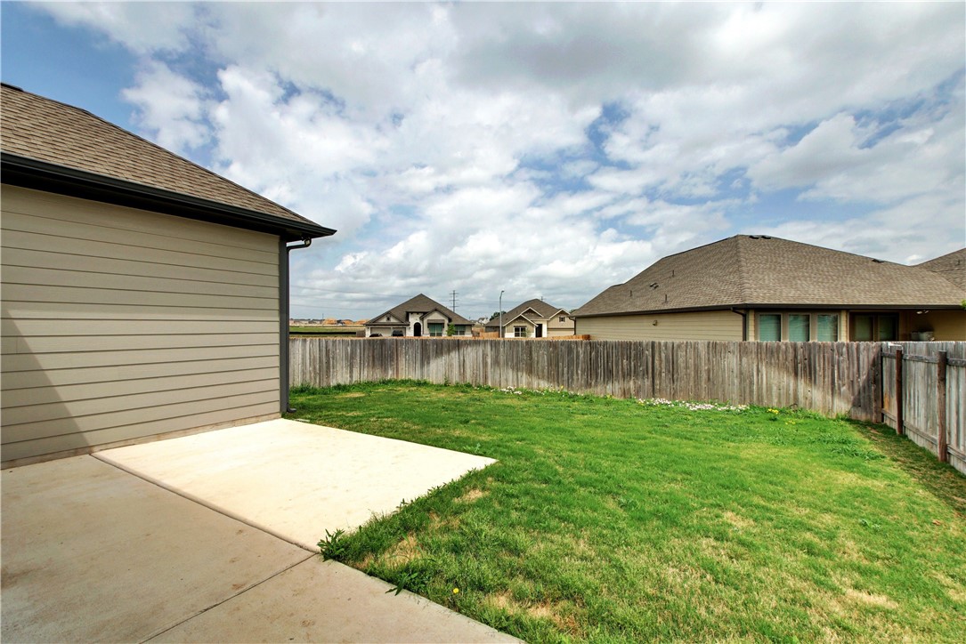104 Finley Street Hutto, TX 78634 - Photo 23 of 37 a backyard of a house with lots of green space