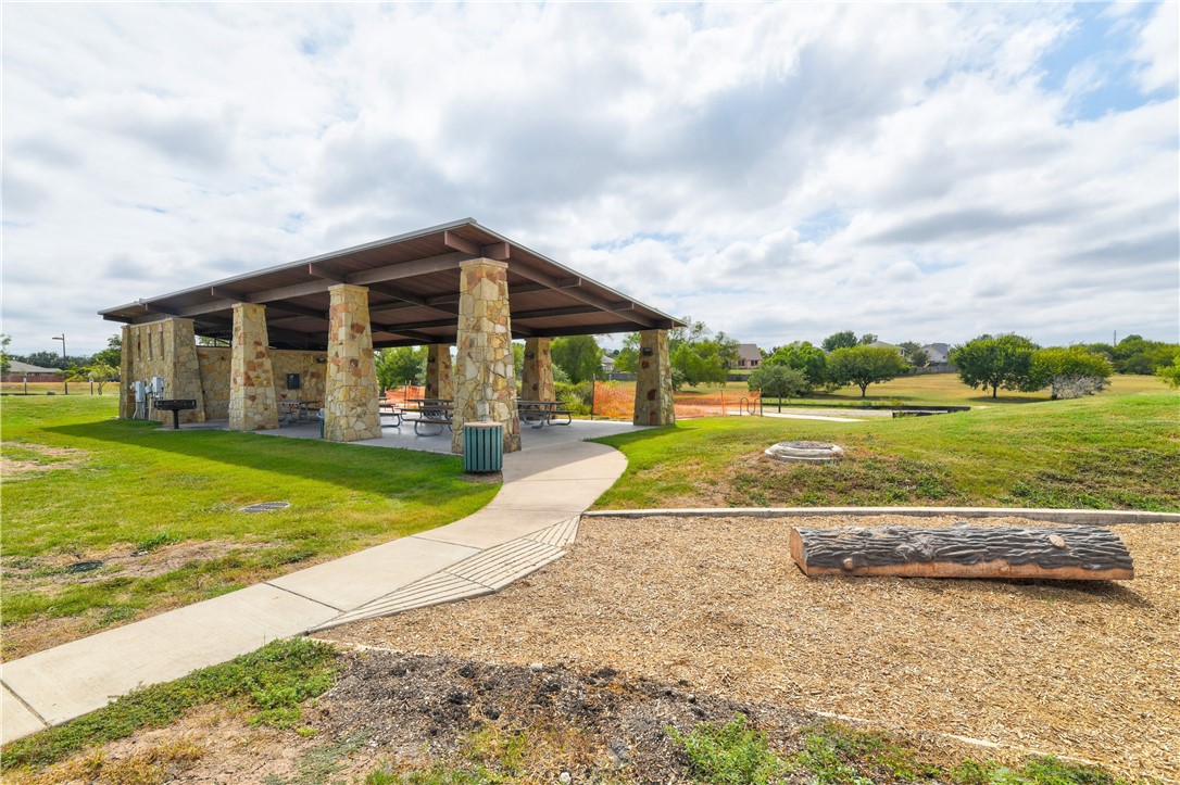 104 Finley Street Hutto, TX 78634 - Photo 26 of 37 a view of a house with a big yard and large trees