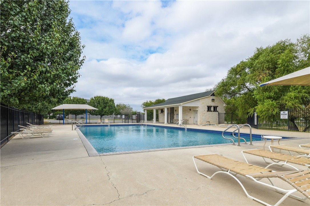 104 Finley Street Hutto, TX 78634 - Photo 28 of 37 a view of a house with pool and chairs
