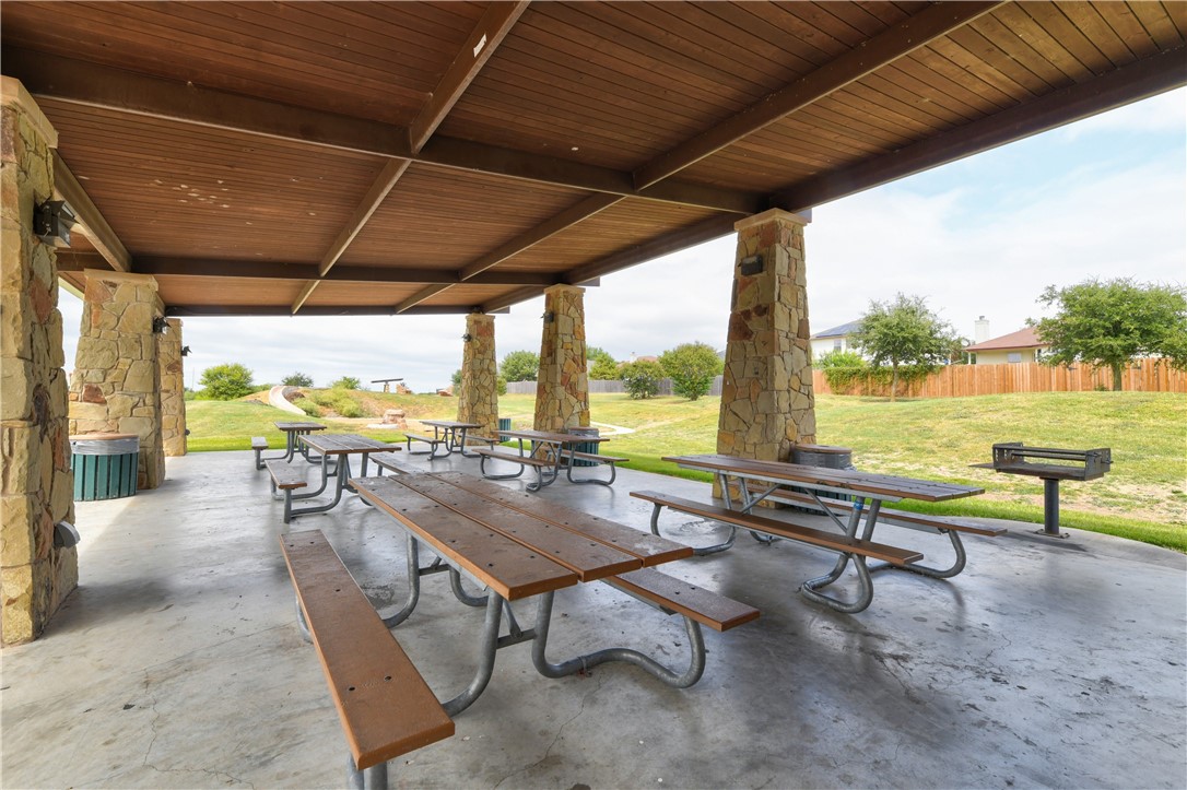 104 Finley Street Hutto, TX 78634 - Photo 29 of 37 a building outdoor space with patio furniture and wooden floor