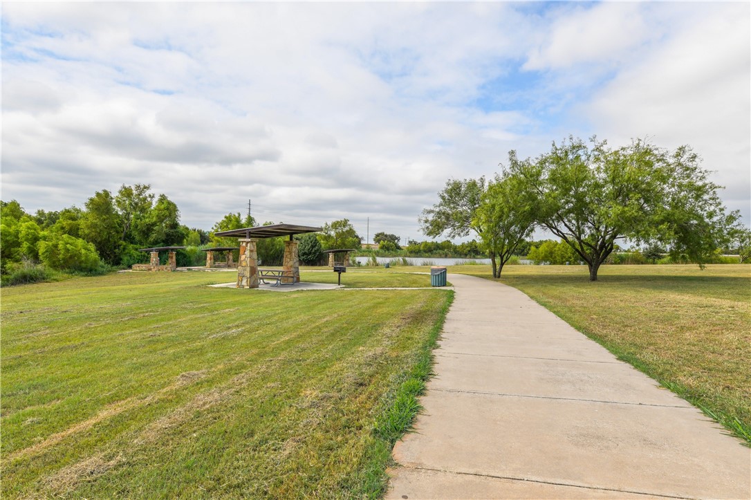 104 Finley Street Hutto, TX 78634 - Photo 33 of 37 a view of swimming pool with garden and trees