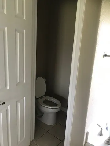 an empty room with wooden floor