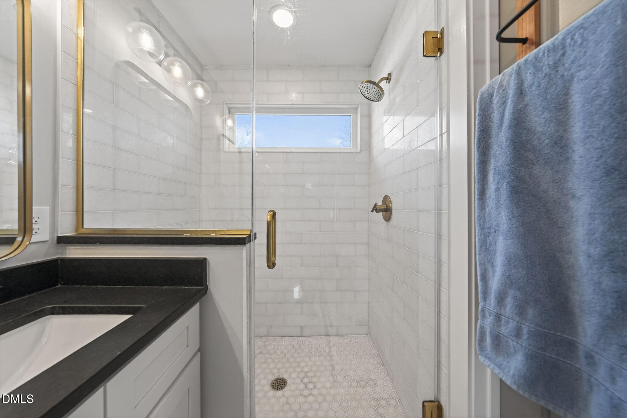 213 Lincoln Court Raleigh, NC 27610 - Photo 32 of 40 a bathroom with a sink a granite counter and a shower