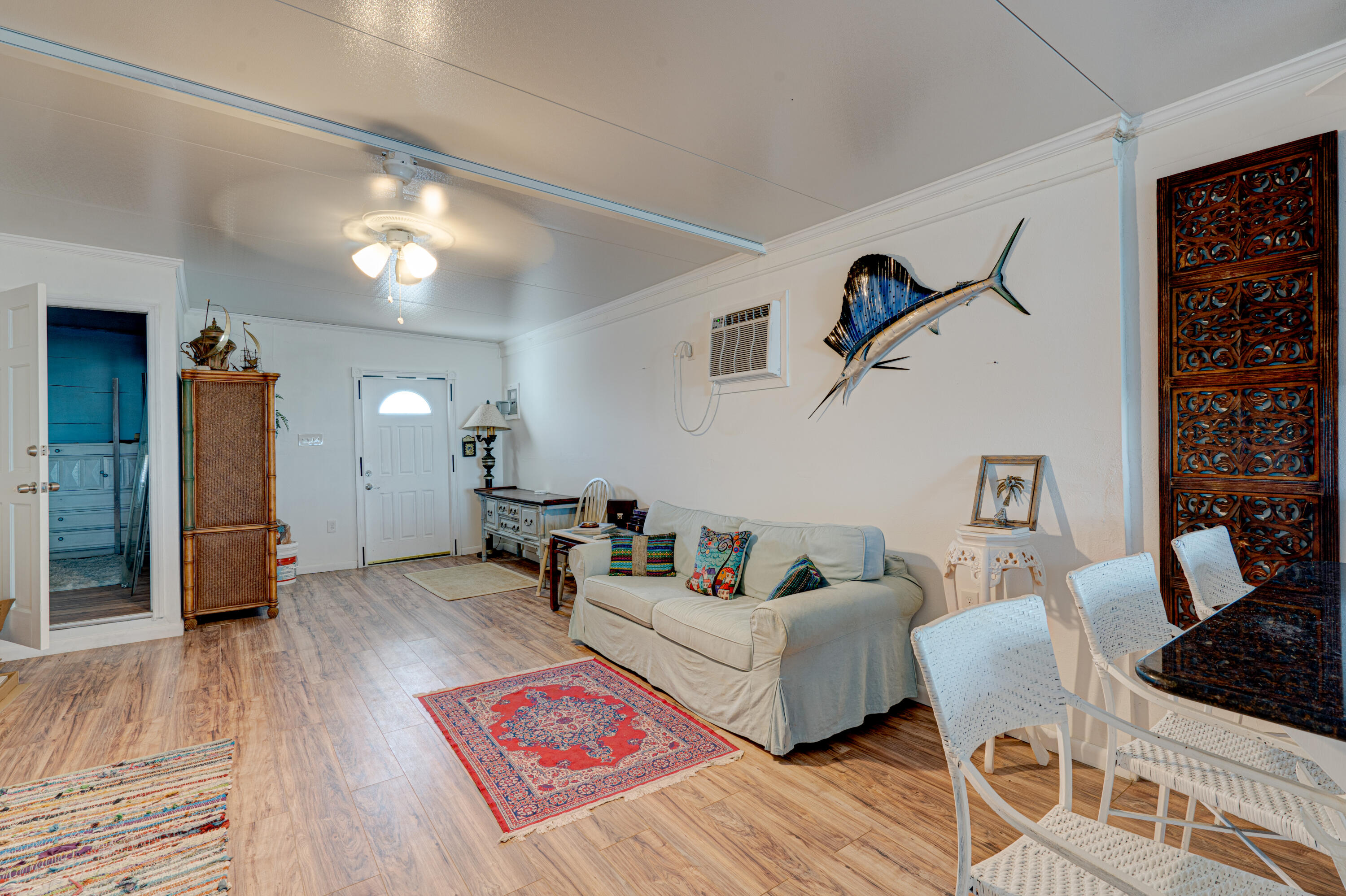 1361 Overseas Highway, Unit E11 Marathon, FL 33050 - Photo 20 of 46 a living room with furniture and wooden floor