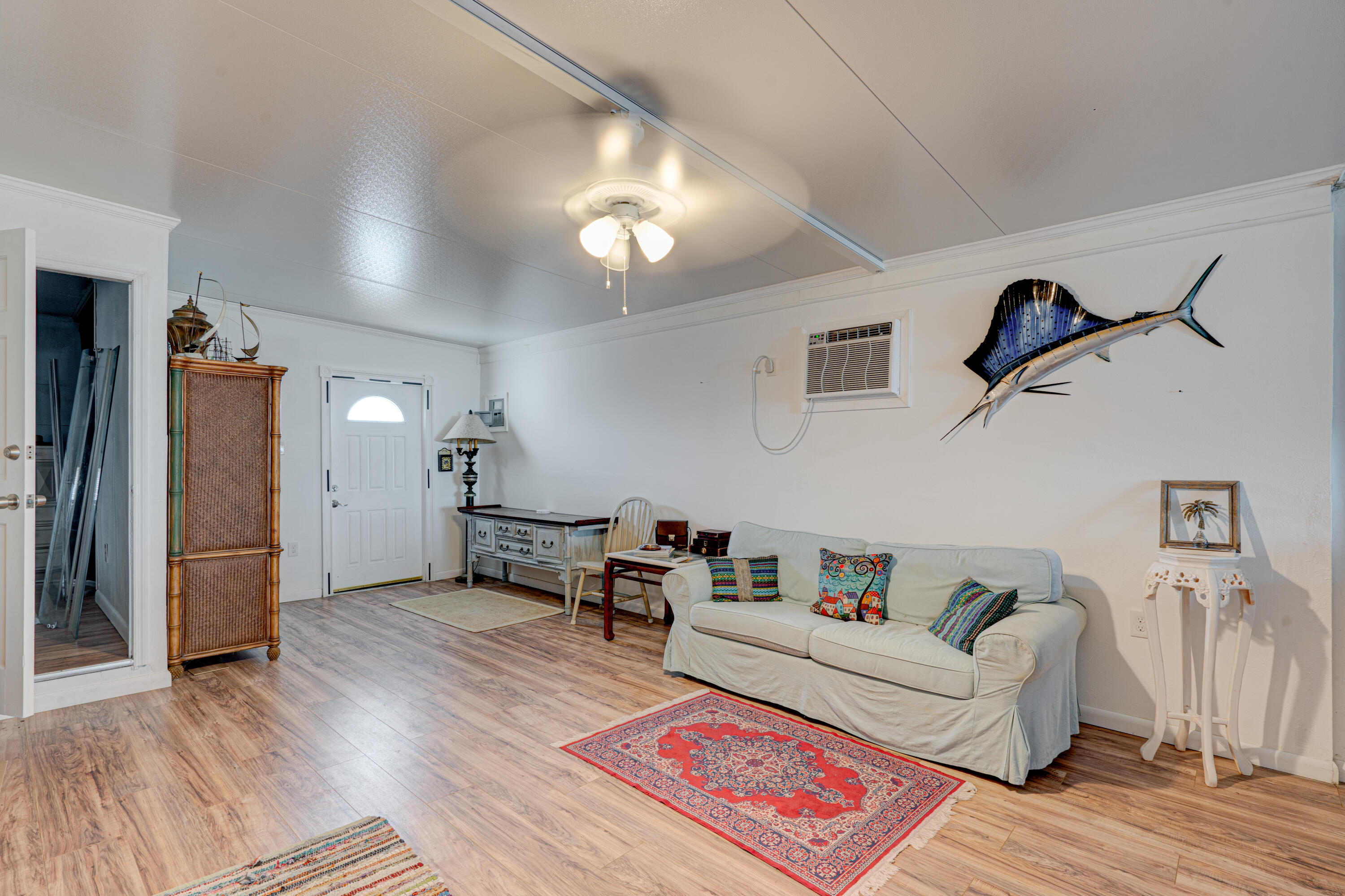 1361 Overseas Highway, Unit E11 Marathon, FL 33050 - Photo 21 of 46 a living room with furniture and a wooden floor