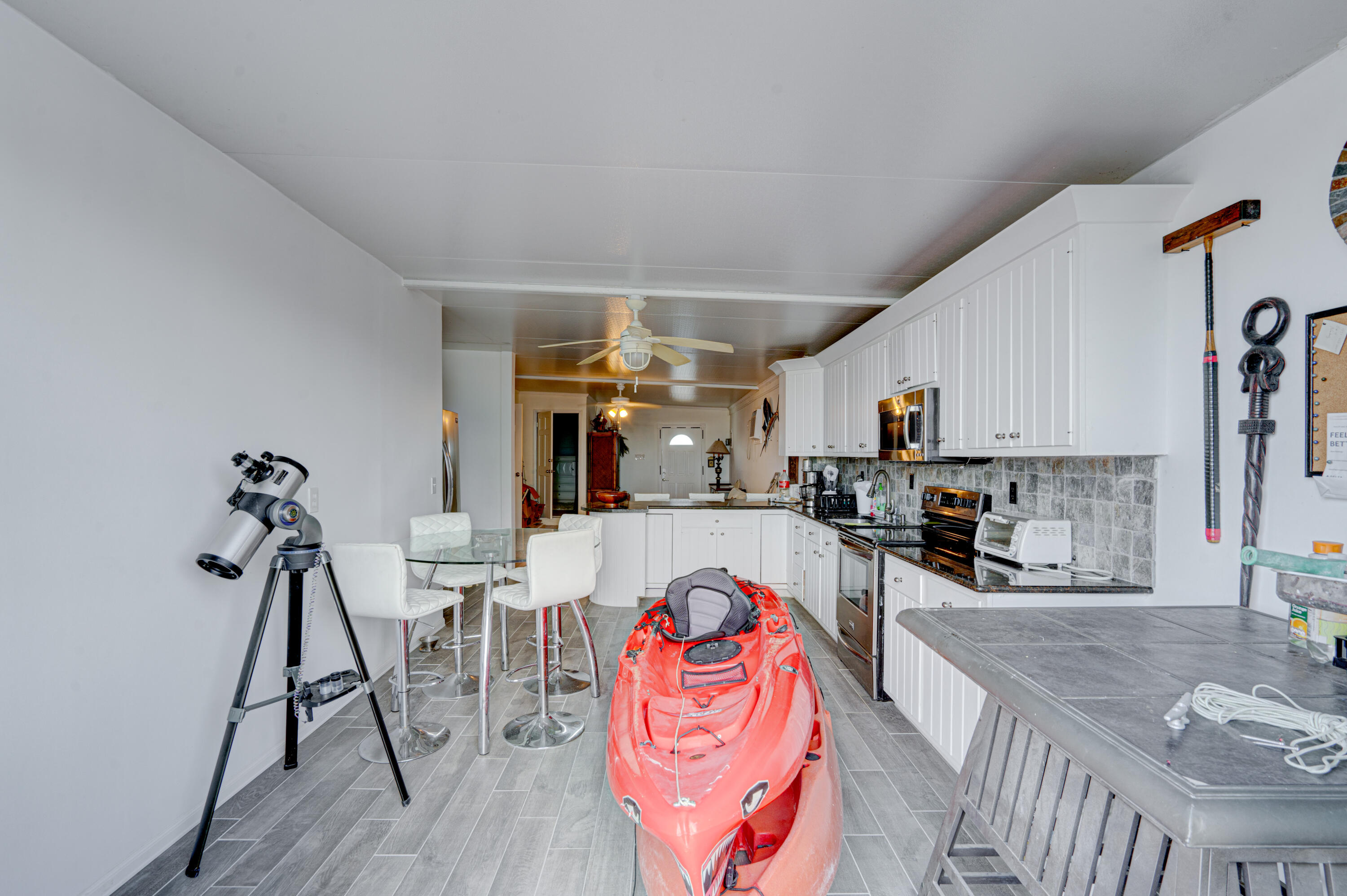 1361 Overseas Highway, Unit E11 Marathon, FL 33050 - Photo 27 of 46 a living room with furniture a rug and white walls