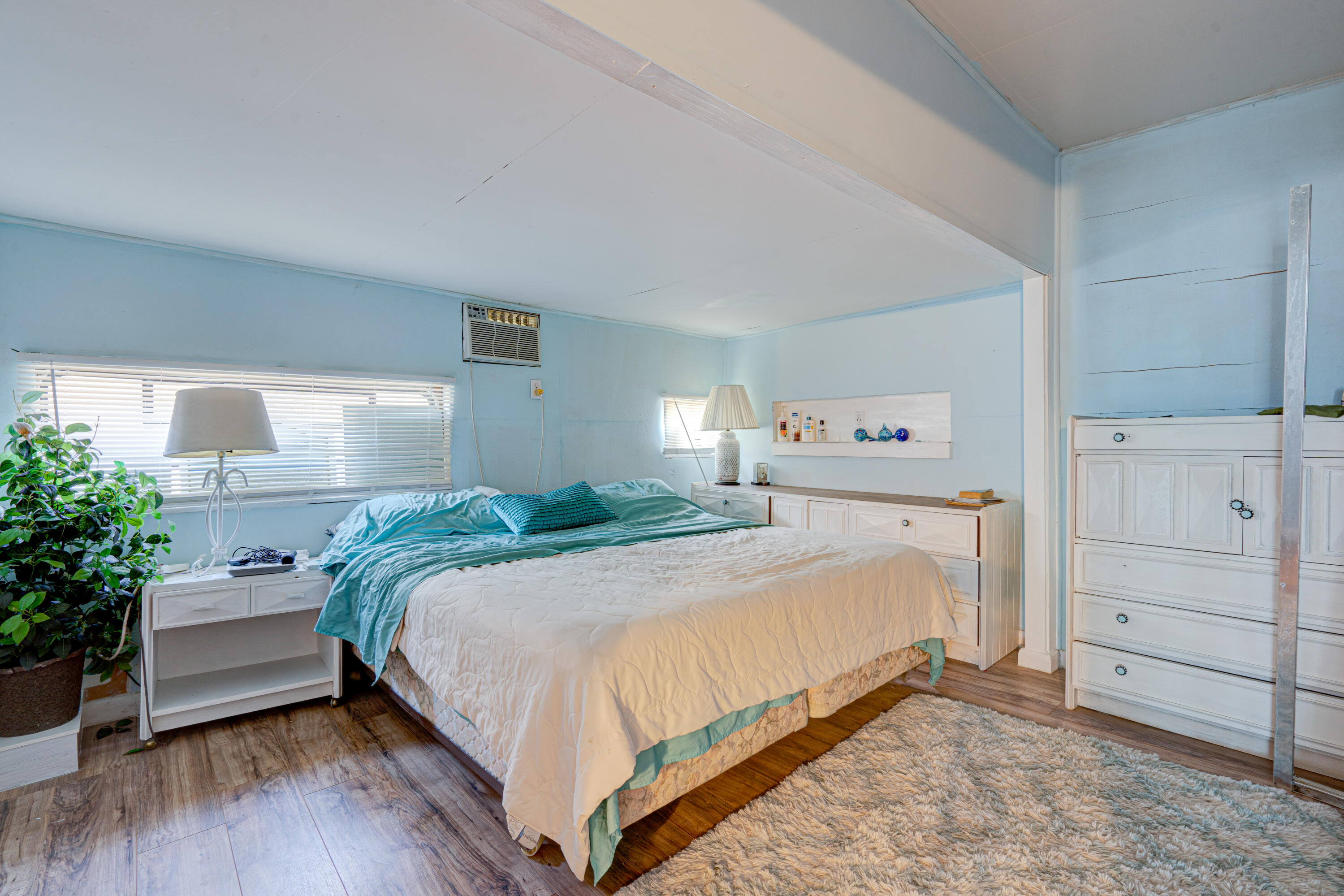 1361 Overseas Highway, Unit E11 Marathon, FL 33050 - Photo 41 of 46 a bedroom with a bed and a couch