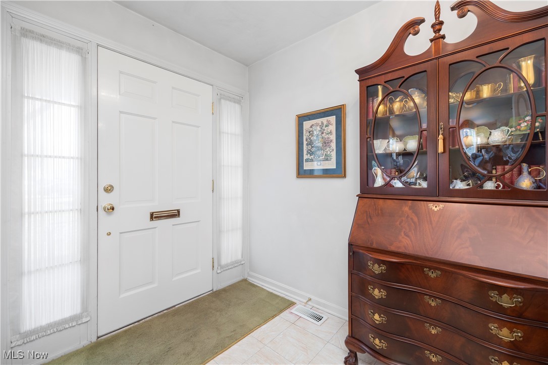 26907 Lake Road Bay Village, OH 44140 - Photo 11 of 33 This lovely foyer boasts a high-end wood door flanked by sidelights.