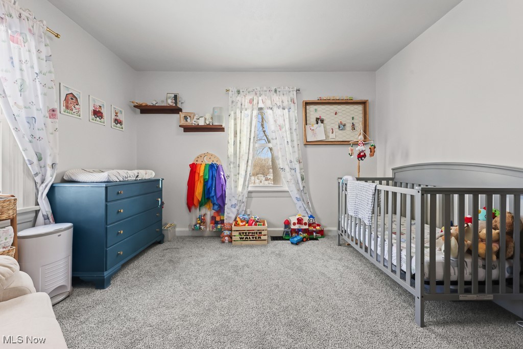 4722 Navarre Road Southwest Canton, OH 44706 - Photo 17 of 38 Bedroom with a nursery area and light colored carpet