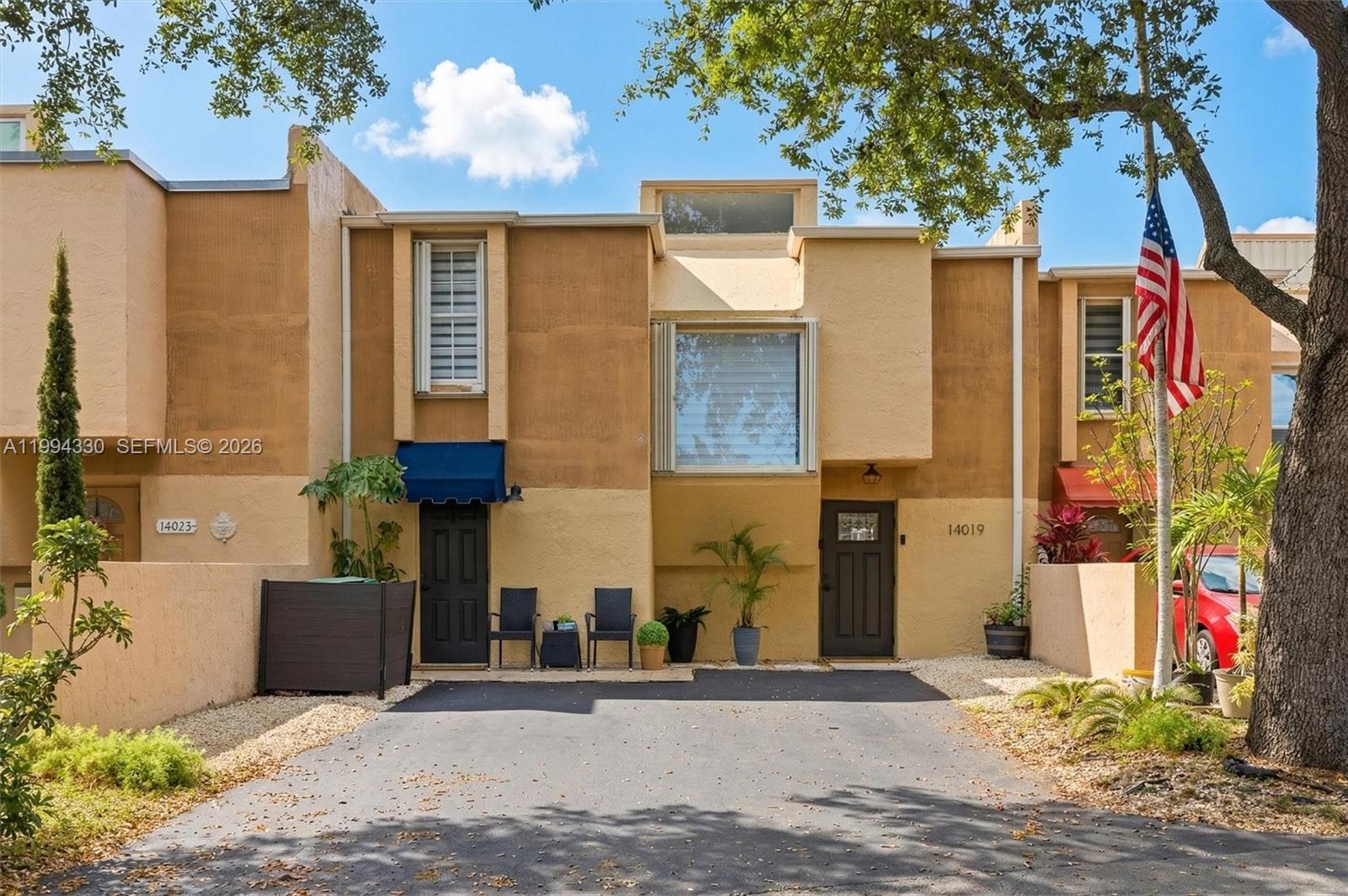 14019 Southwest 67th Terrace Miami, FL 33183 - Photo 1 of 36 front view of a house with a street