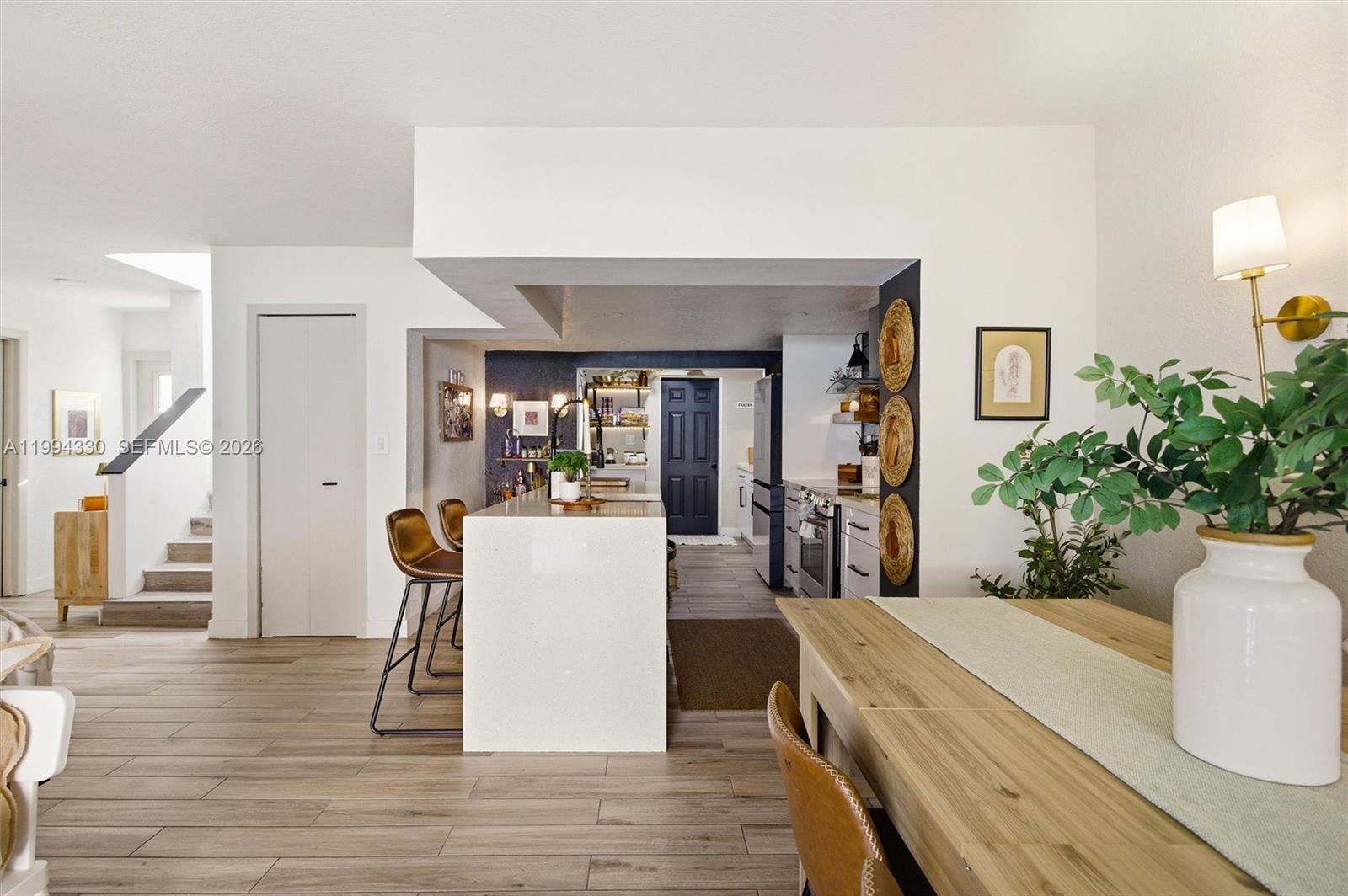 14019 Southwest 67th Terrace Miami, FL 33183 - Photo 12 of 36 a living room with furniture and a wooden floor