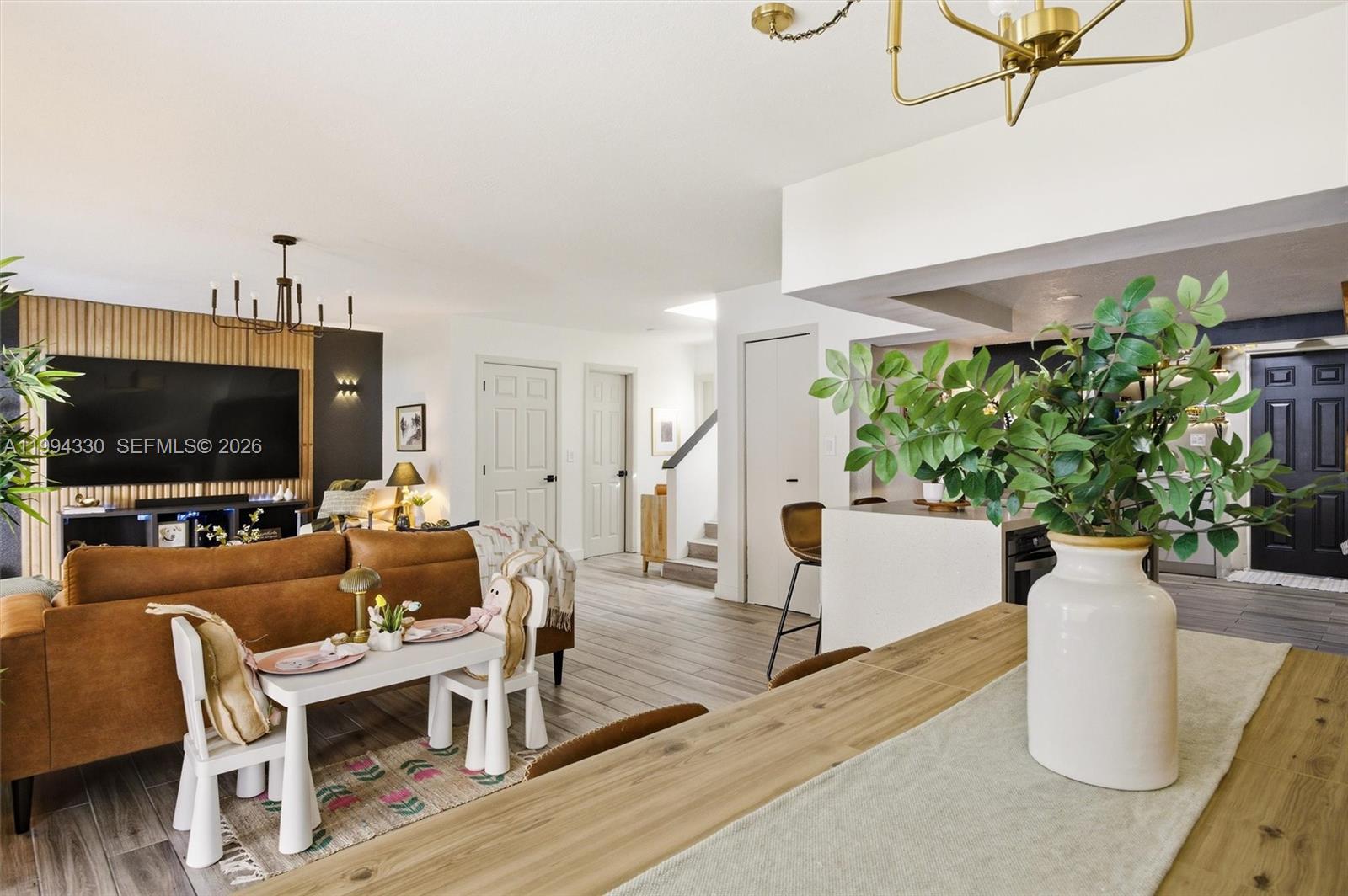 14019 Southwest 67th Terrace Miami, FL 33183 - Photo 13 of 36 a living room with furniture and a flat screen tv