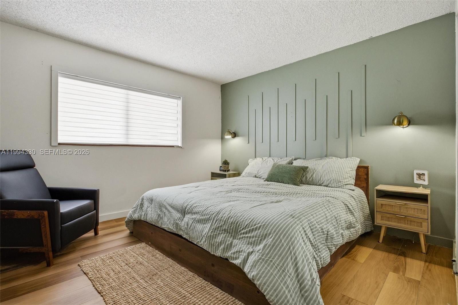 14019 Southwest 67th Terrace Miami, FL 33183 - Photo 20 of 36 a bedroom with a bed and wooden floor