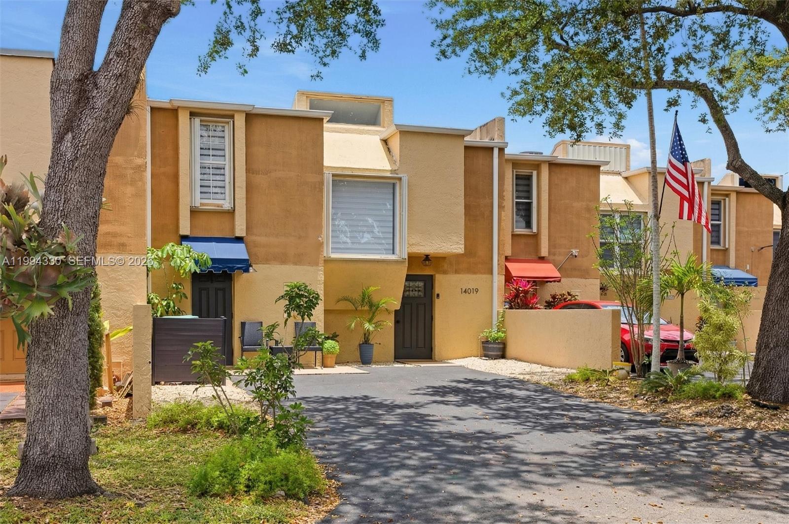 14019 Southwest 67th Terrace Miami, FL 33183 - Photo 2 of 36 a front view of a house