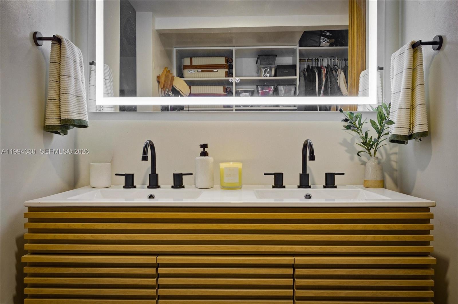 14019 Southwest 67th Terrace Miami, FL 33183 - Photo 23 of 36 a bathroom with a sink and a mirror