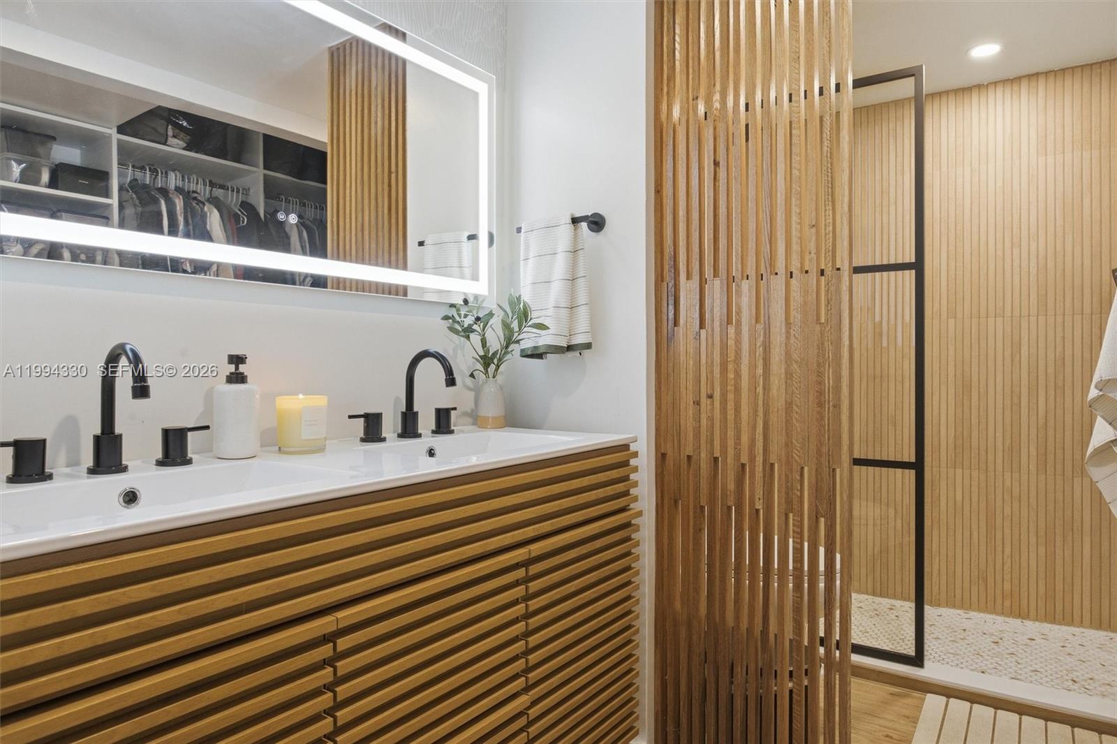 14019 Southwest 67th Terrace Miami, FL 33183 - Photo 24 of 36 a bathroom with a sink and a mirror
