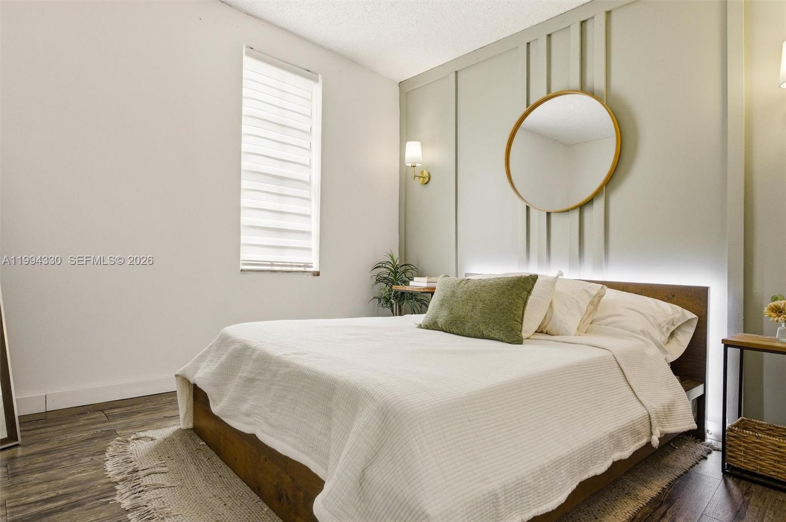 14019 Southwest 67th Terrace Miami, FL 33183 - Photo 28 of 36 a bedroom with a bed and a painting on the wall