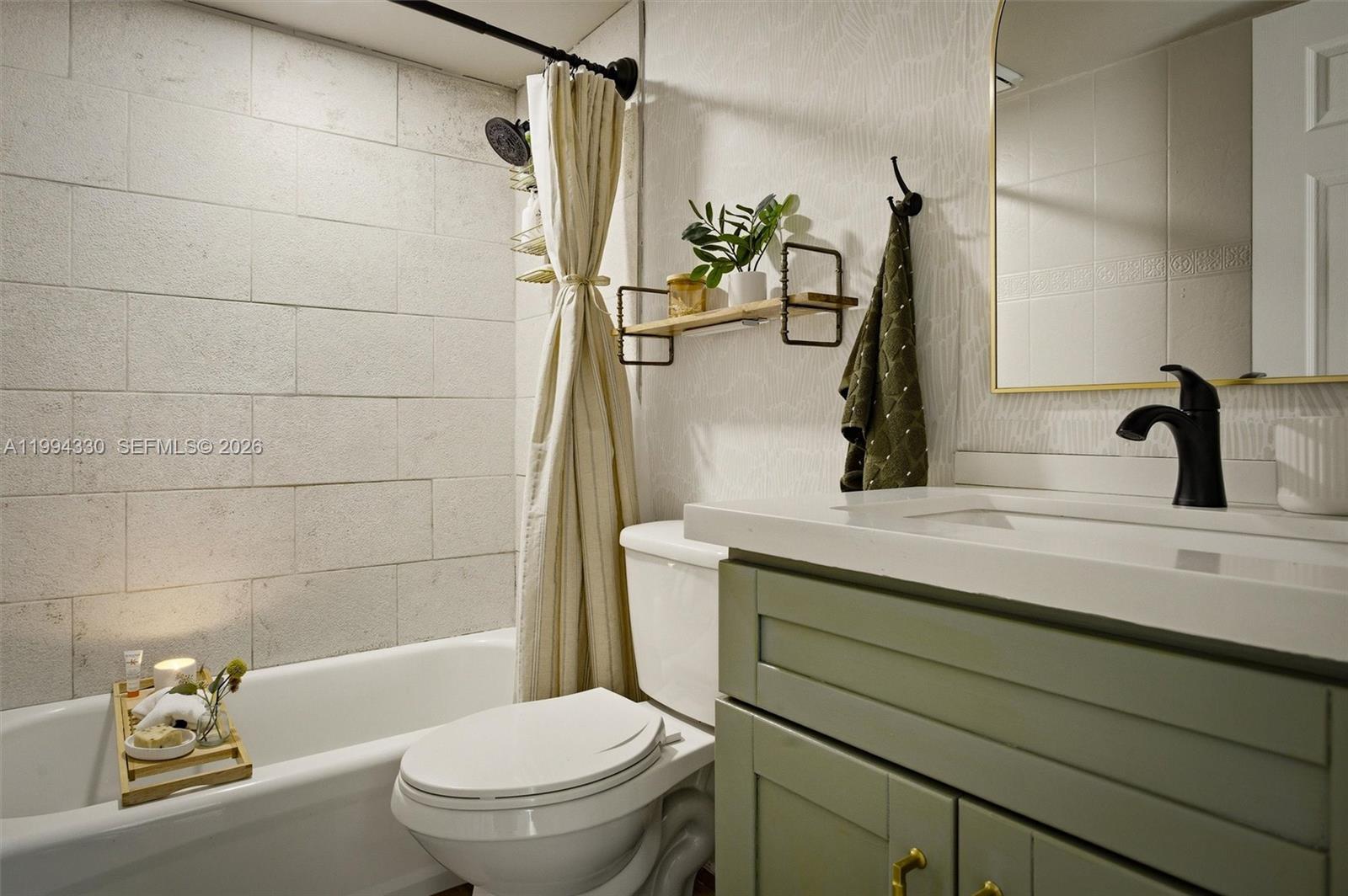 14019 Southwest 67th Terrace Miami, FL 33183 - Photo 30 of 36 a bathroom with a sink a toilet and shower