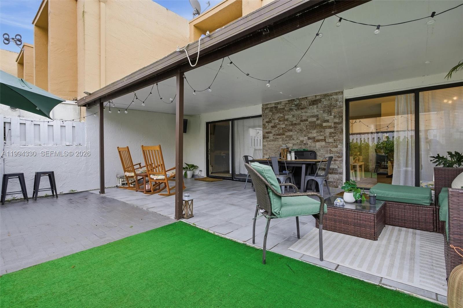 14019 Southwest 67th Terrace Miami, FL 33183 - Photo 36 of 36 a living room with furniture and a garden