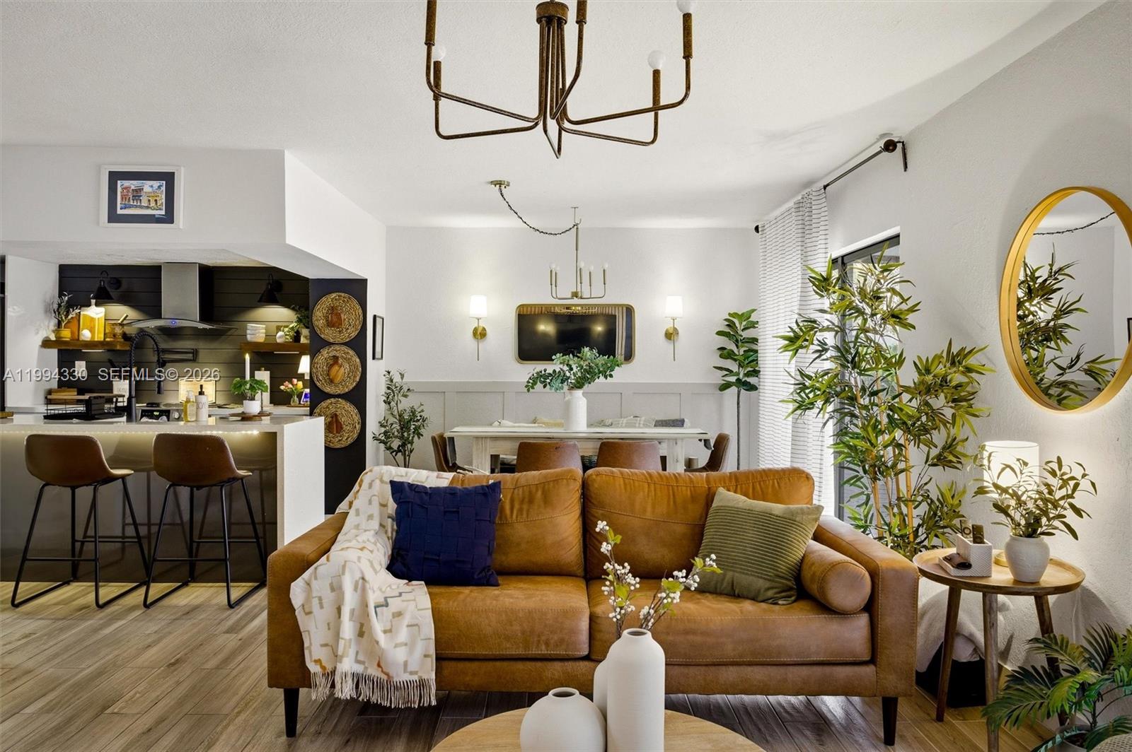 14019 Southwest 67th Terrace Miami, FL 33183 - Photo 4 of 36 a living room with furniture and a flat screen tv