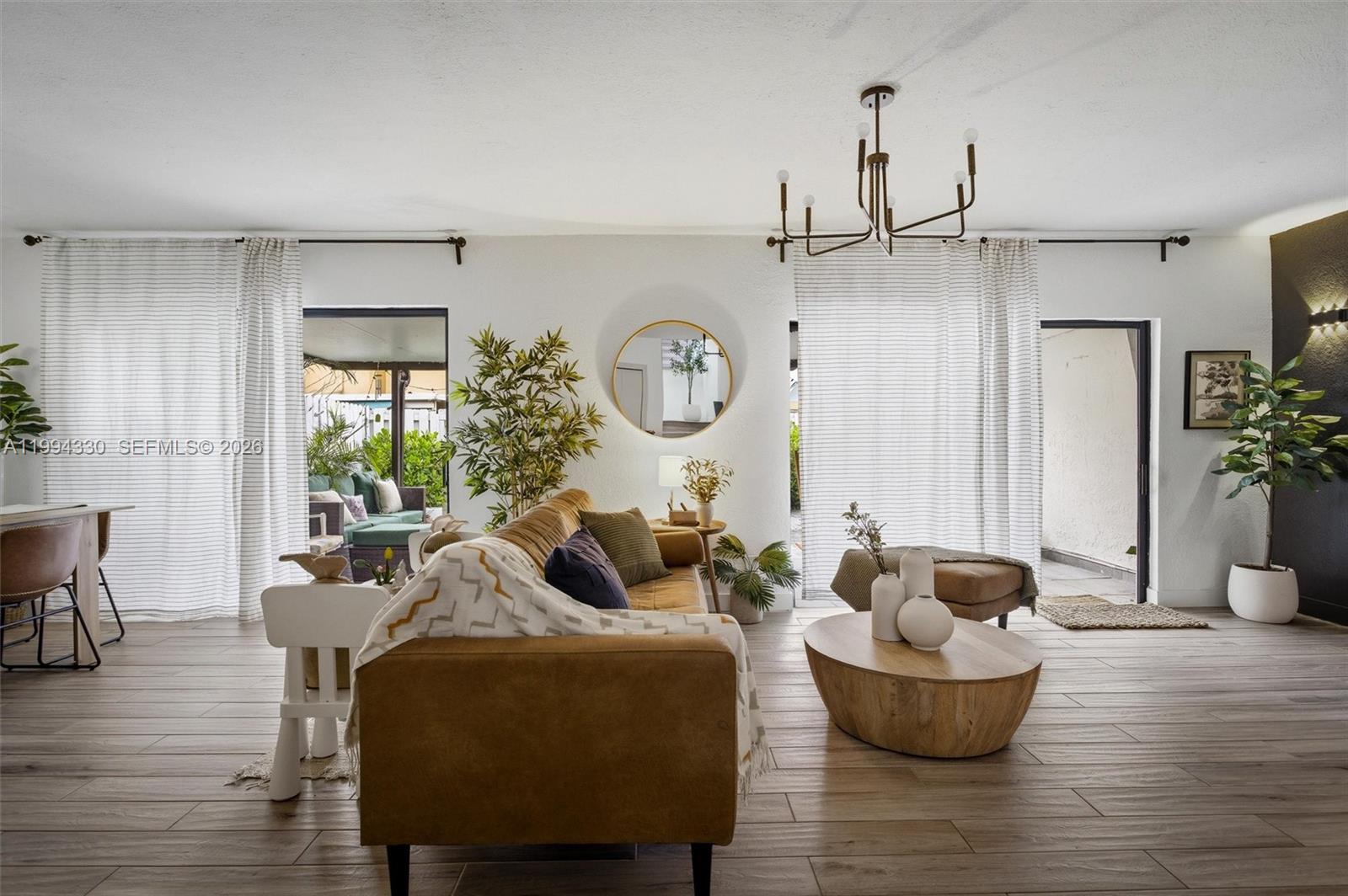 14019 Southwest 67th Terrace Miami, FL 33183 - Photo 6 of 36 a living room with furniture and a large window