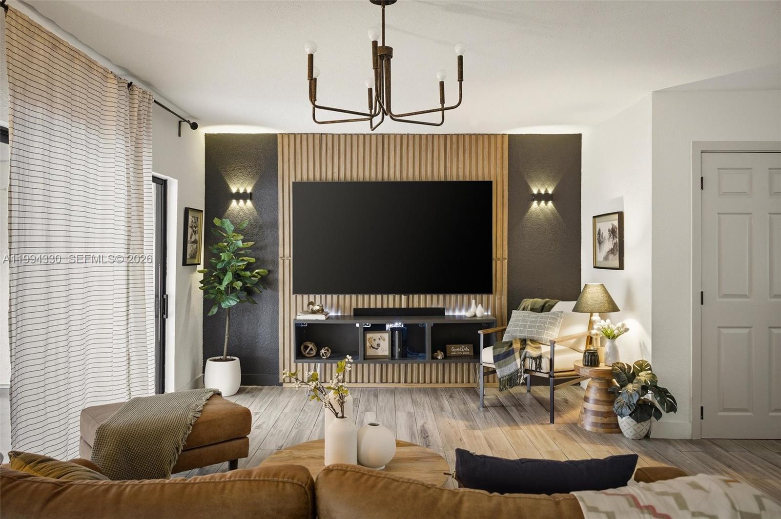 14019 Southwest 67th Terrace Miami, FL 33183 - Photo 7 of 36 a living room with furniture and a flat screen tv