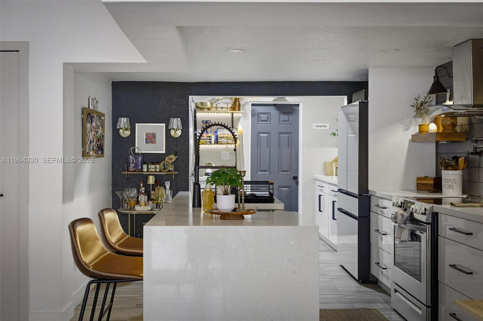 14019 Southwest 67th Terrace Miami, FL 33183 - Photo 8 of 36 a living room with furniture a rug and a painting on the wall