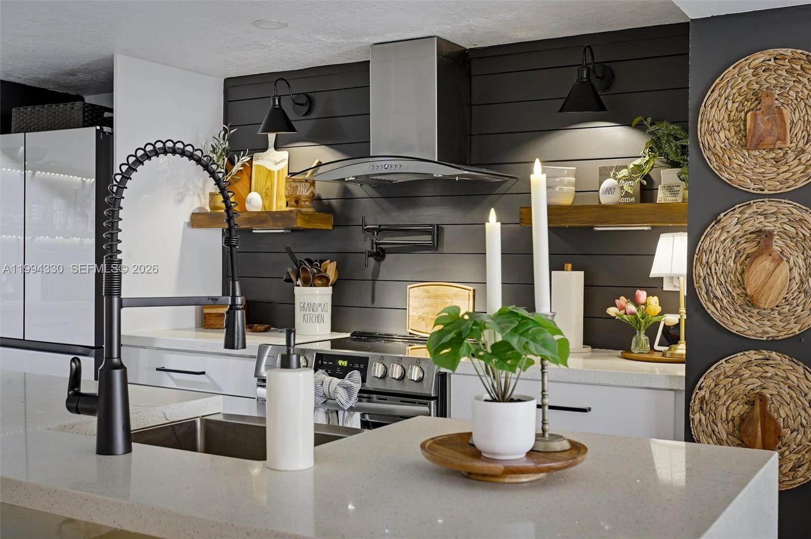 14019 Southwest 67th Terrace Miami, FL 33183 - Photo 9 of 36 a kitchen with a table and chairs