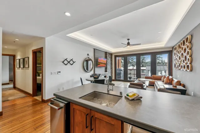 a kitchen with a sink stove and refrigerator