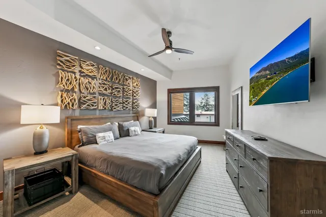 a bathroom with double vanity sinks and a shower