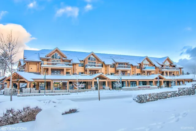 a front view of a building with a yard