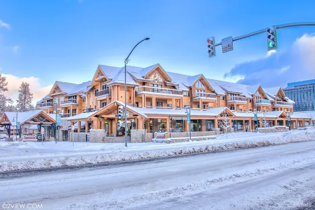 a front view of a building with a yard