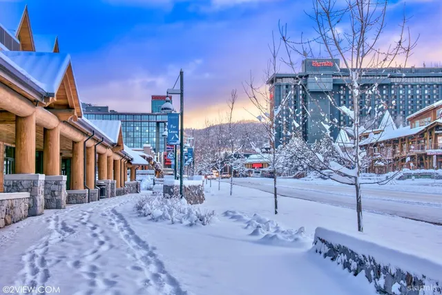 a view of a house with a snow in the yard