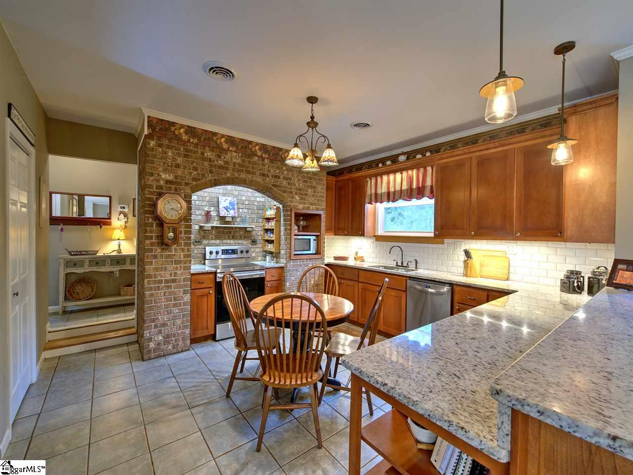 55 Arnold Branch Road Woodruff, SC 29388 - Photo 11 of 36 Granite countertops...Tile backsplash...Under cabinet lighting.